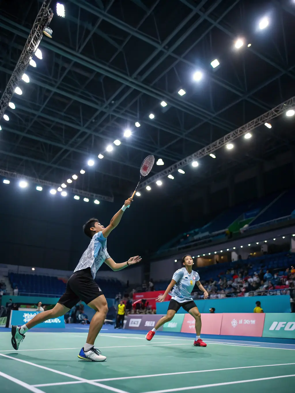 A dynamic shot of people playing badminton, showcasing the speed and agility of the sport, set in a well-lit indoor gymnasium.